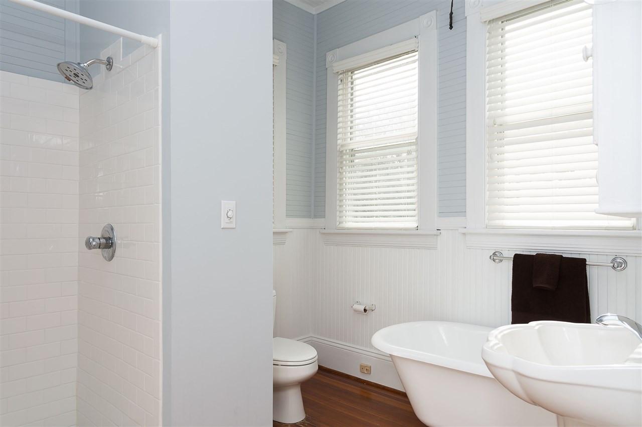316 North Boundary Street Raleigh, NC 27604 - Photo 9 of 23 a bathroom with a toilet a sink and a window