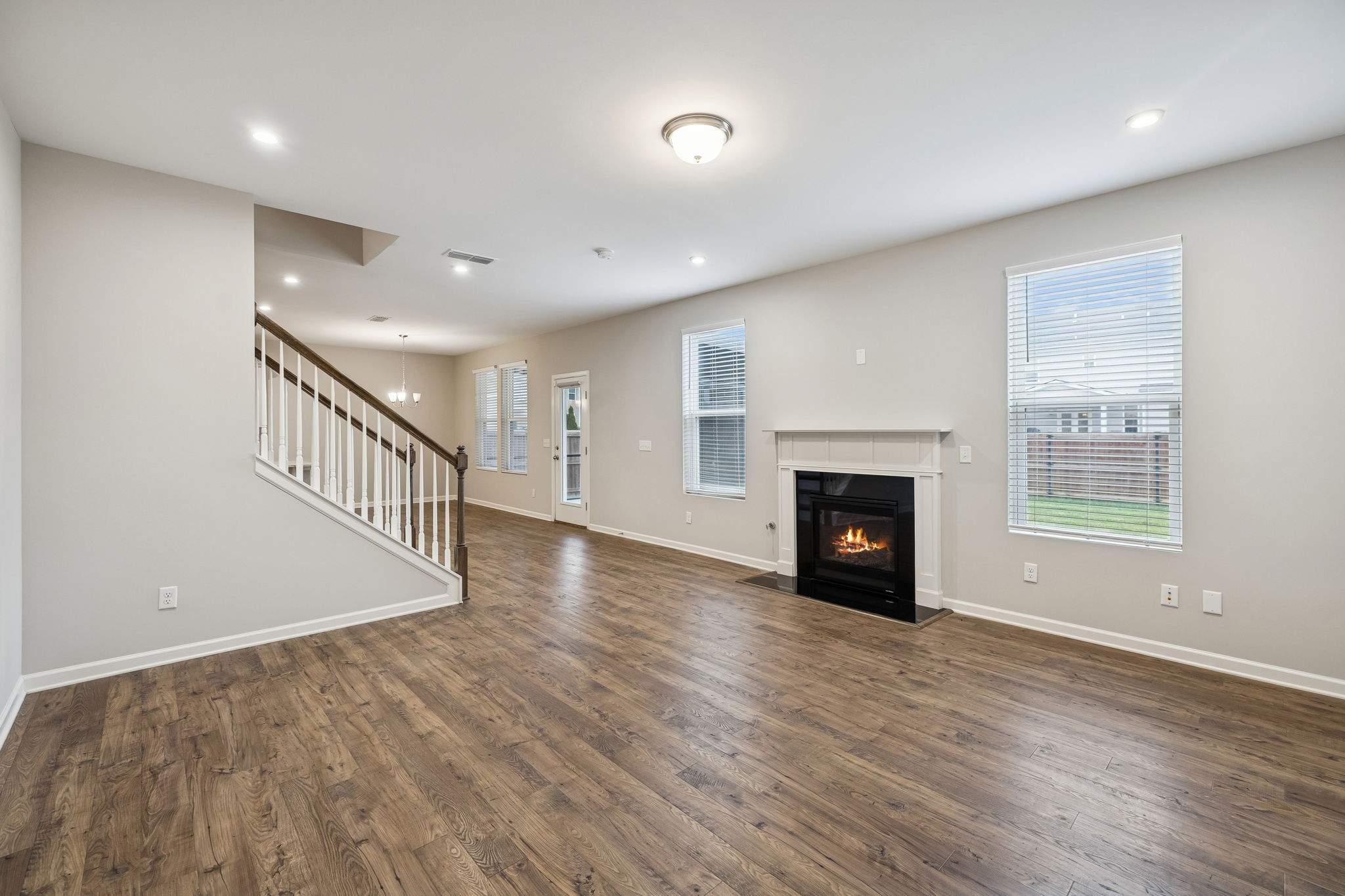 3611 Willow Bay Lane Murfreesboro, TN 37128 - Photo 14 of 46 a view of an empty room with wooden floor fireplace and a window