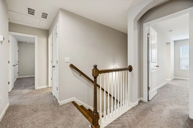 a view of a hallway view with staircase