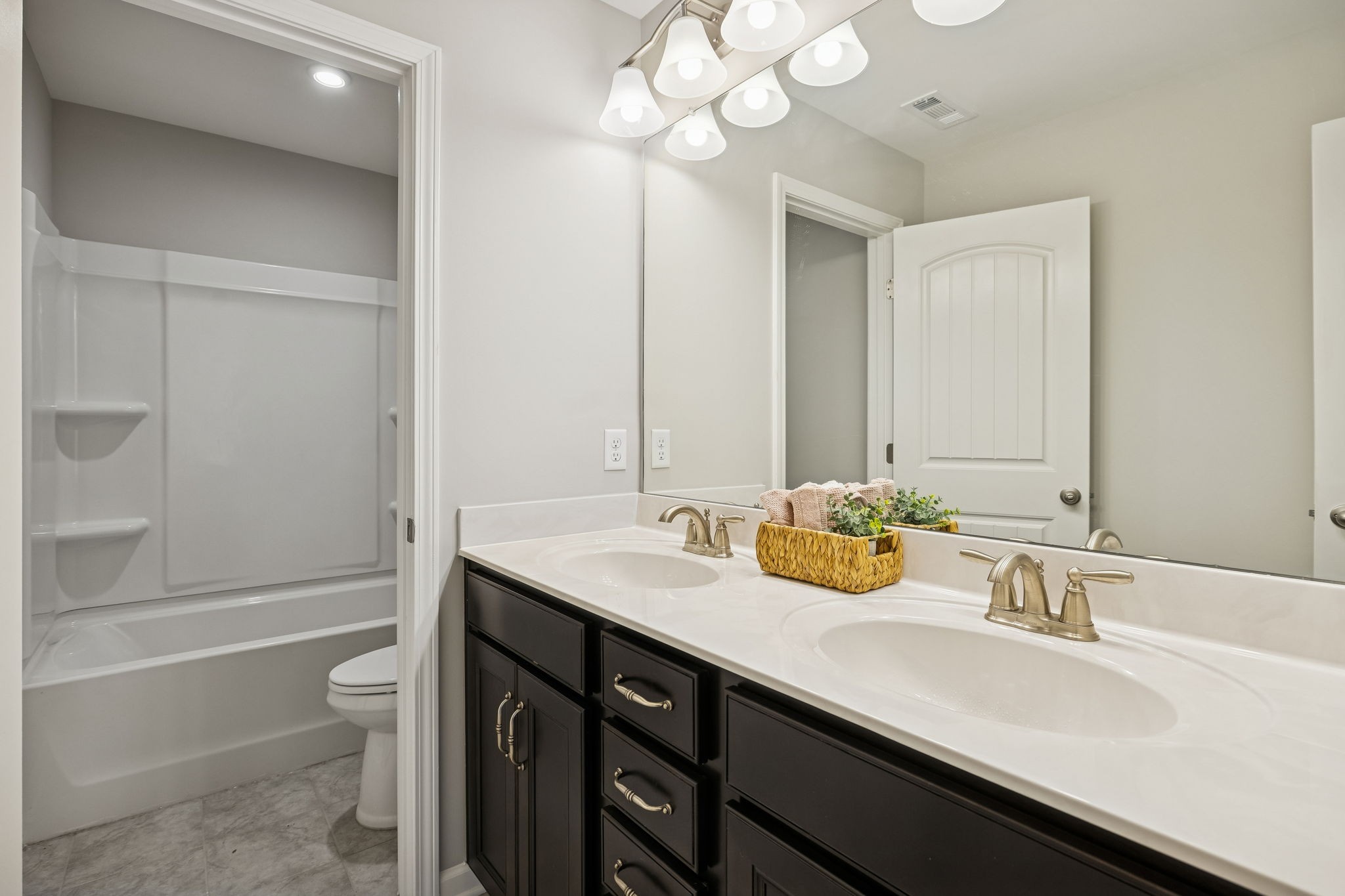 3611 Willow Bay Lane Murfreesboro, TN 37128 - Photo 27 of 46 a bathroom with a granite countertop sink a toilet and bathtub