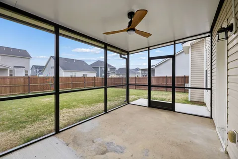 a view of a back yard from a balcony