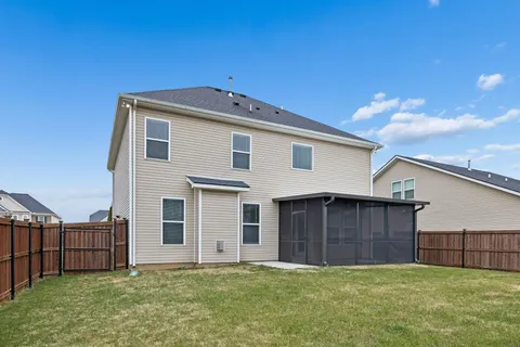 a view of a swimming pool with a yard