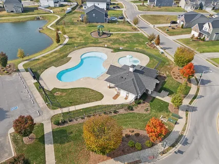 an aerial view of residential houses with outdoor space