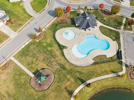 an aerial view of a house with swimming pool