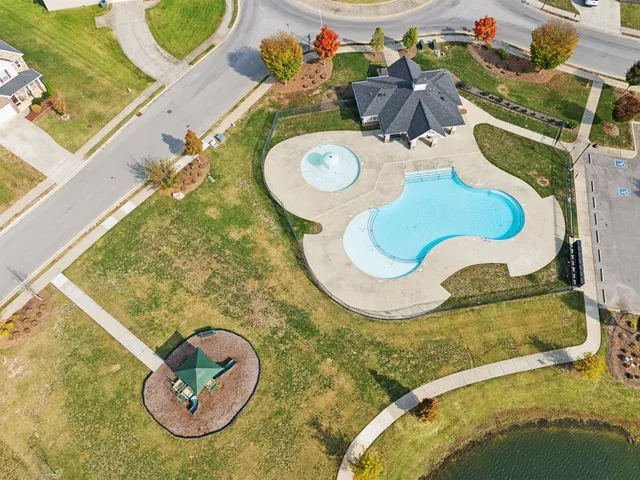 an aerial view of a house with swimming pool