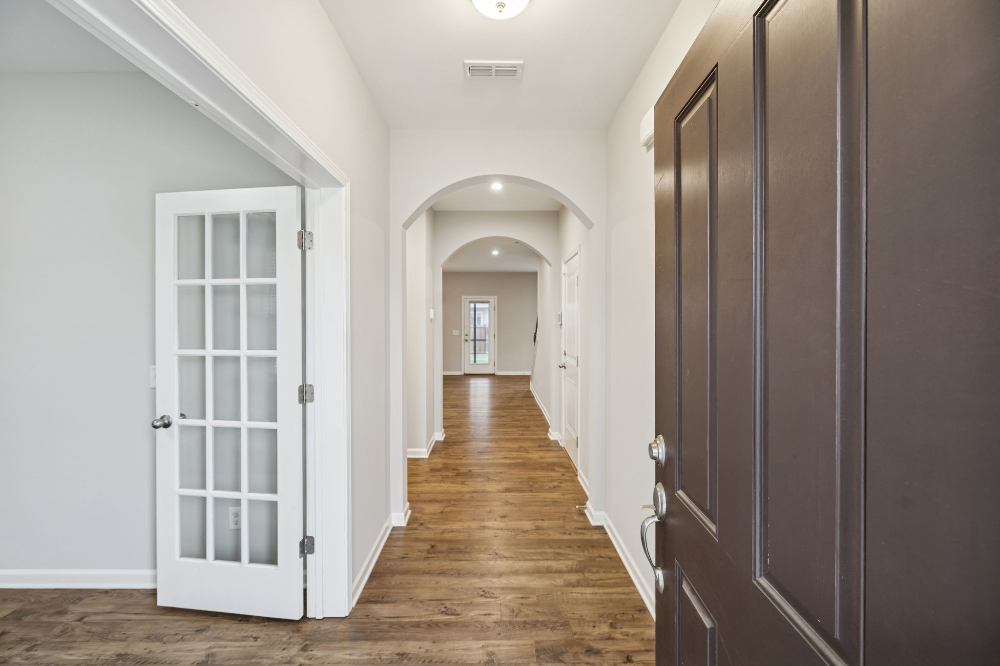 3611 Willow Bay Lane Murfreesboro, TN 37128 - Photo 5 of 46 a view of a hallway with wooden floor and staircase