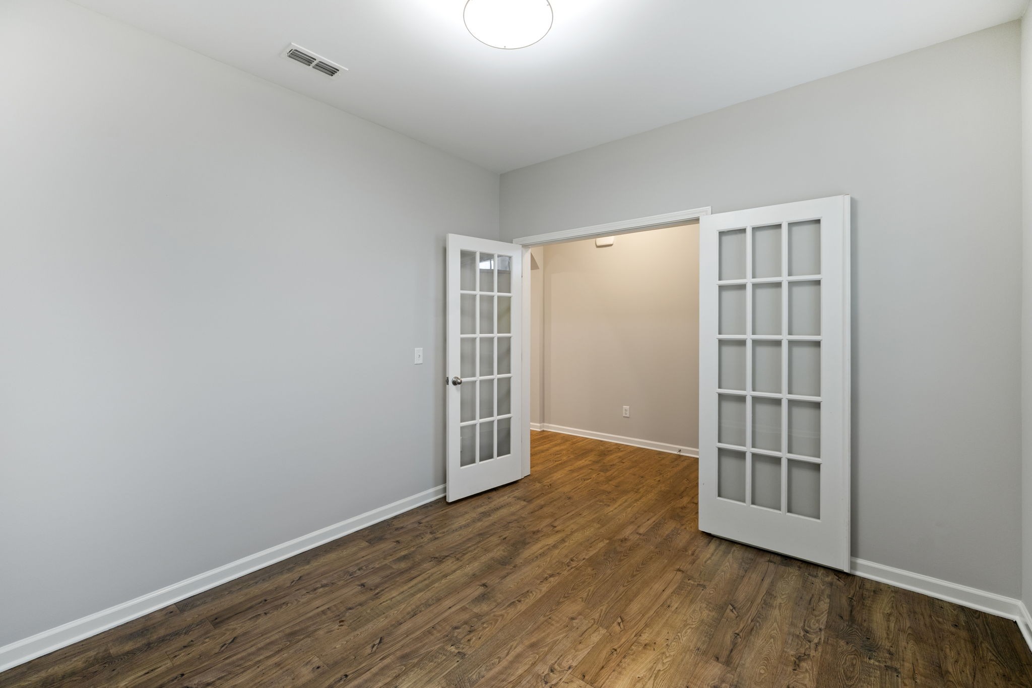 3611 Willow Bay Lane Murfreesboro, TN 37128 - Photo 7 of 46 an empty room with wooden floor and windows