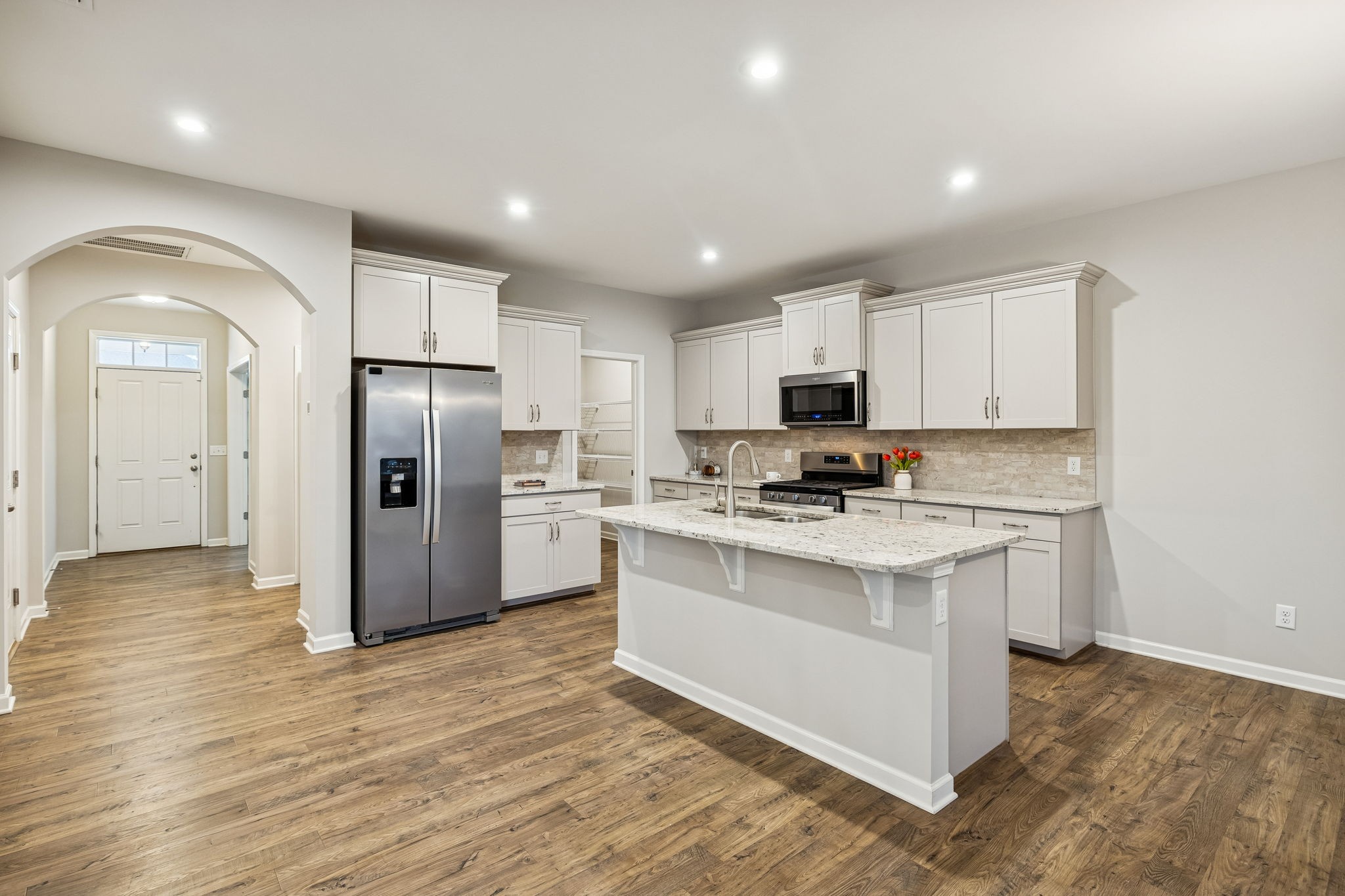 3611 Willow Bay Lane Murfreesboro, TN 37128 - Photo 8 of 46 a kitchen with stainless steel appliances granite countertop a refrigerator a stove a sink and a microwave