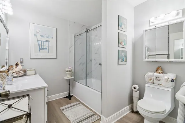 a living room with furniture and view of kitchen