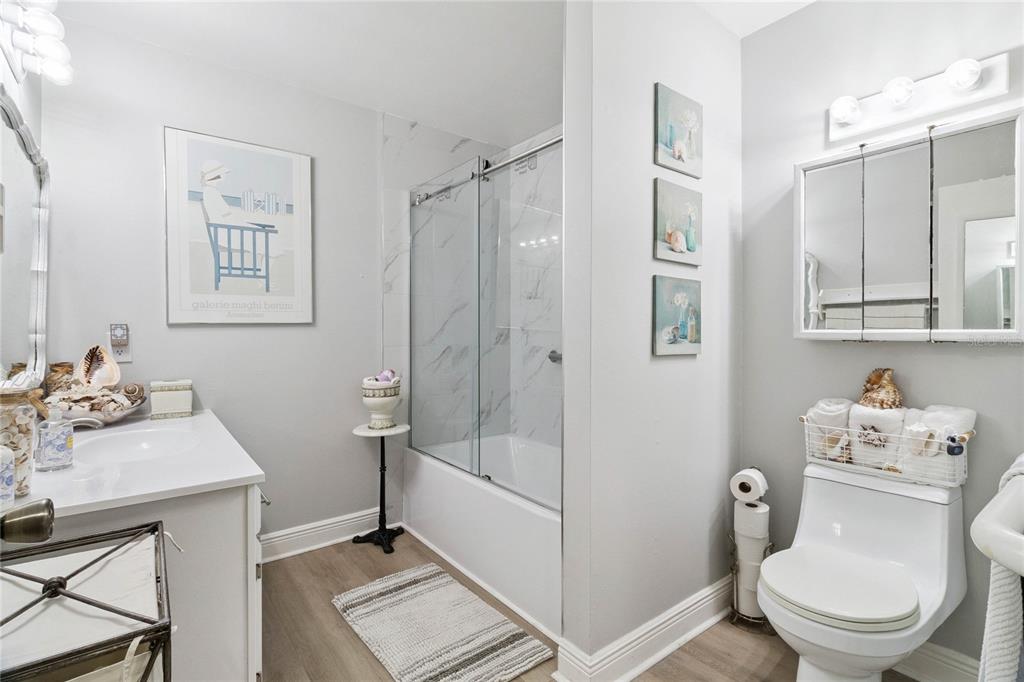 4191 Corey Road Malabar, FL 32950 - Photo 21 of 53 a bathroom with a sink toilet and shower