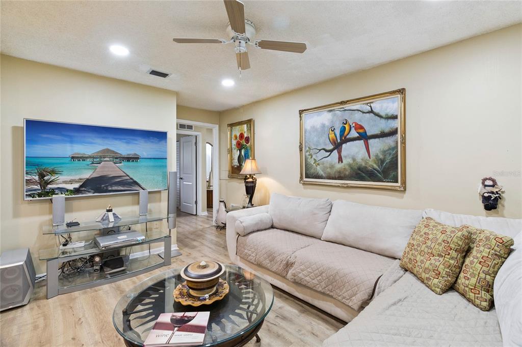 4191 Corey Road Malabar, FL 32950 - Photo 23 of 53 a living room with furniture and a flat screen tv