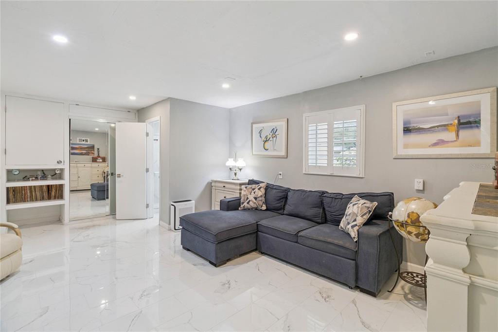 4191 Corey Road Malabar, FL 32950 - Photo 24 of 53 a living room with furniture and view of kitchen