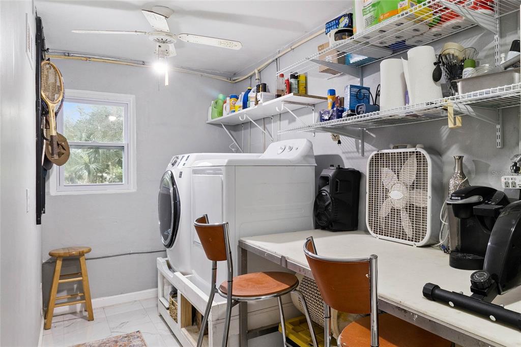 4191 Corey Road Malabar, FL 32950 - Photo 27 of 53 a utility room with dryer washer and a view of living room