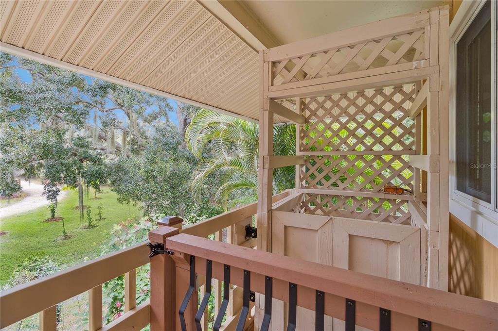 4191 Corey Road Malabar, FL 32950 - Photo 28 of 53 a balcony with trees in front of it