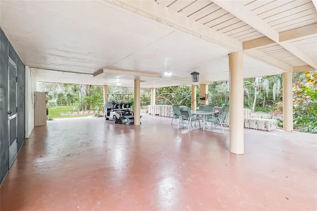 a view of a yard with wooden fence