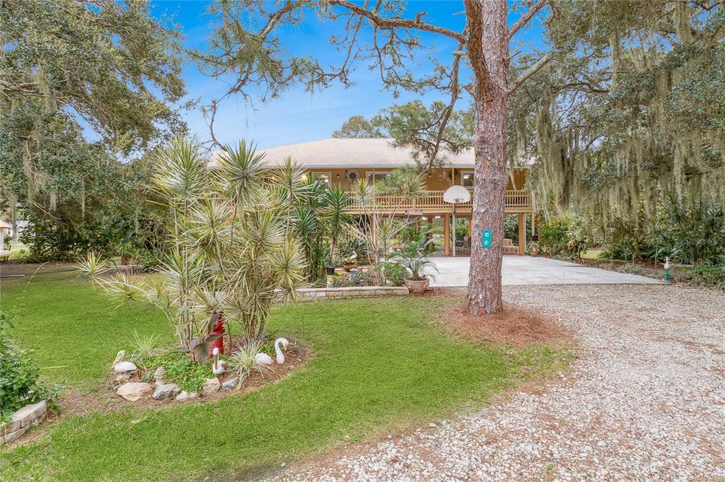 4191 Corey Road Malabar, FL 32950 - Photo 36 of 53 a front view of a house with garden
