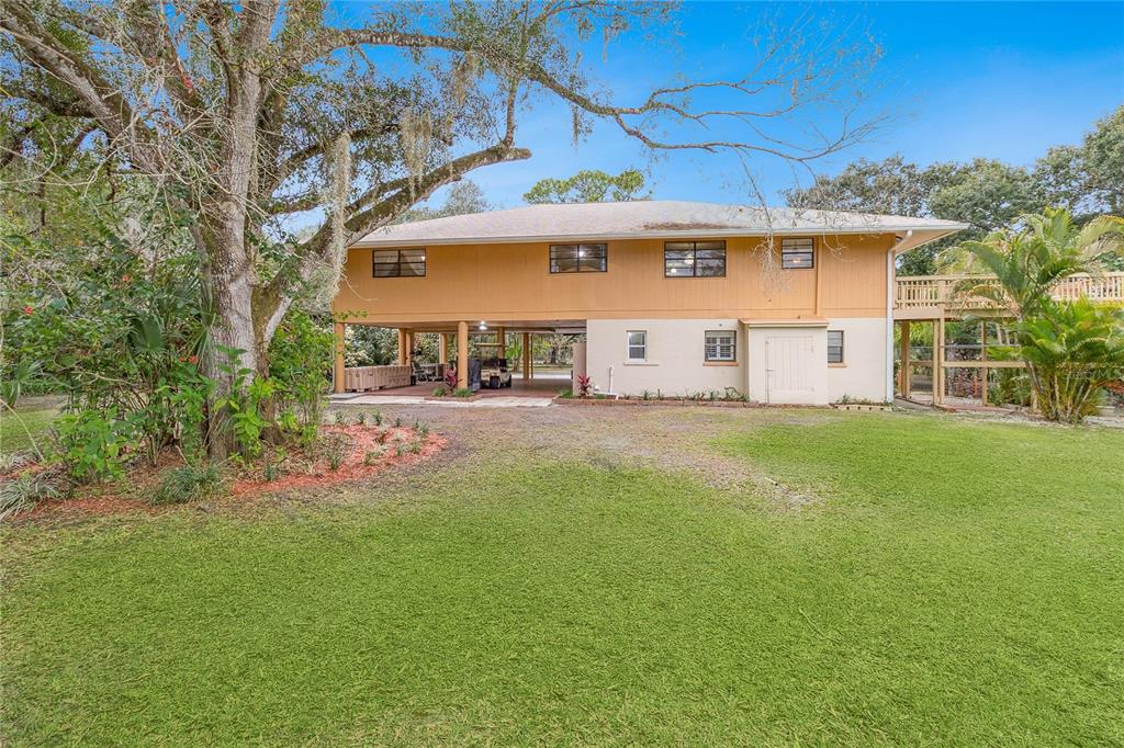 4191 Corey Road Malabar, FL 32950 - Photo 38 of 53 a front view of a house with a yard and a tree