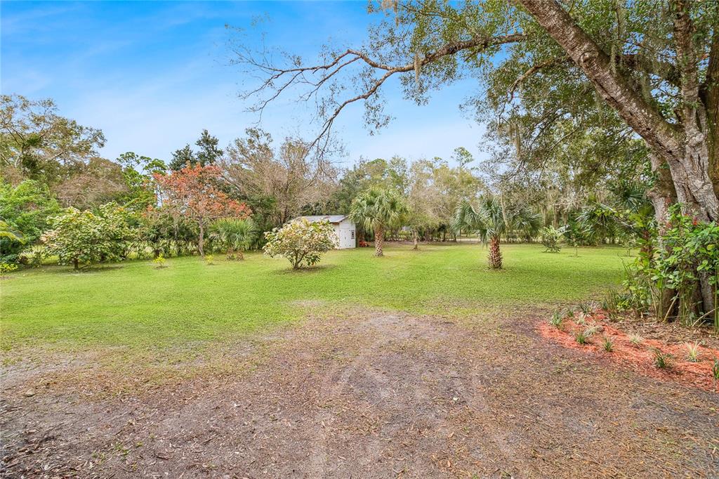 4191 Corey Road Malabar, FL 32950 - Photo 41 of 53 a view of a house with a yard