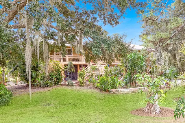 a view of a livingroom with furniture and hardwood floor