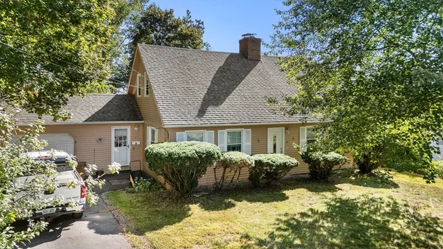 a view of house with yard