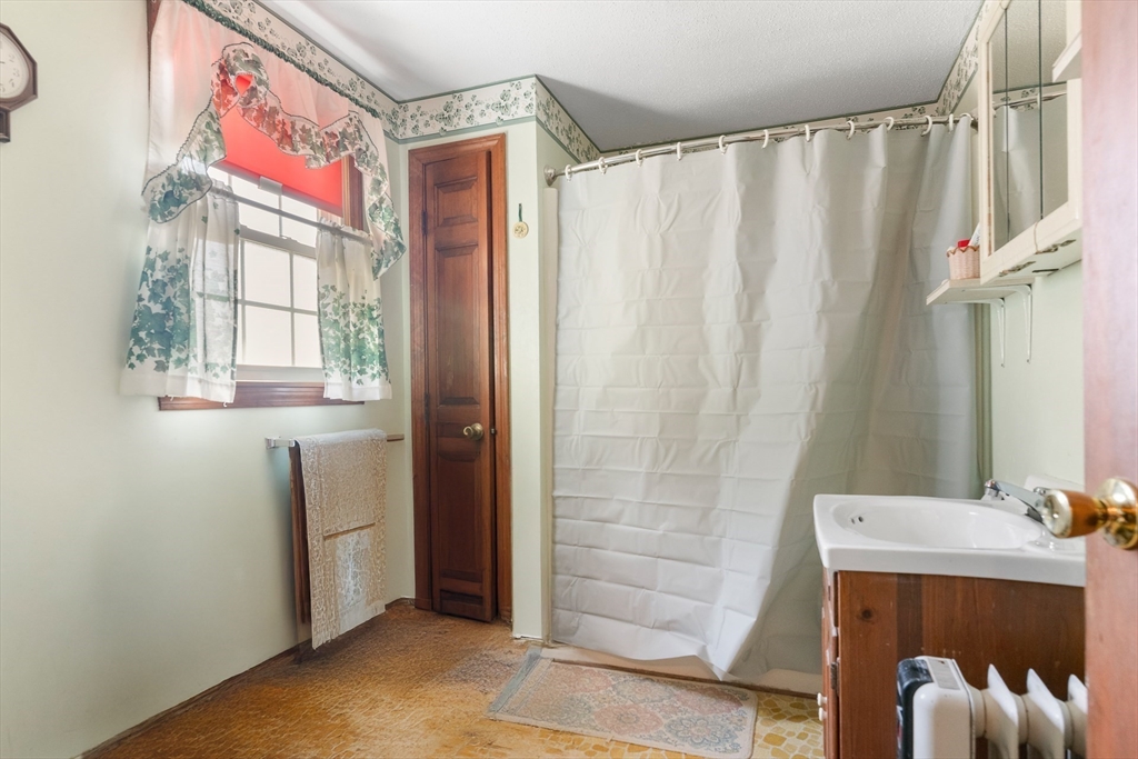 2 Kensington Road Concord, NH 03301 - Photo 20 of 23 a bathroom with a bathtub and shower