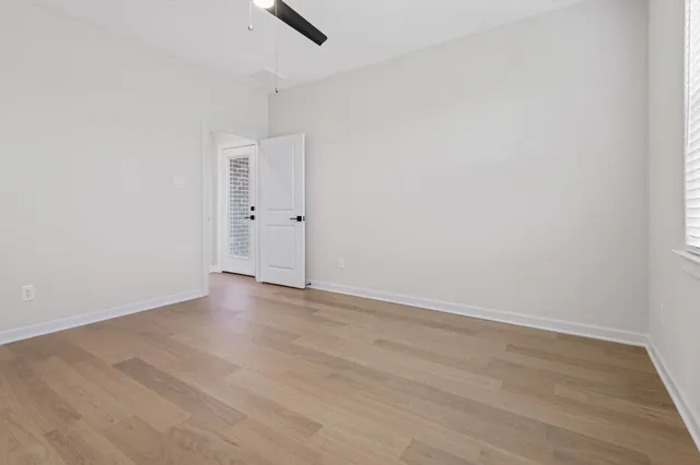 a bathroom with a granite countertop sink and a bathtub