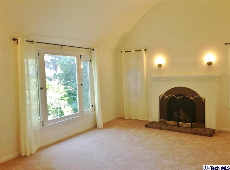 a view of a fireplace with a large window