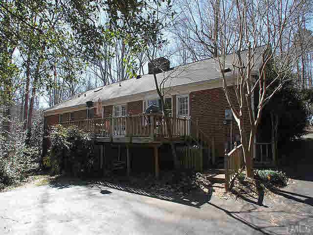 7904 Netherlands Drive Raleigh, NC 27606 - Photo 12 of 15 Deck overlooking wooded park-like setting. Exterior Back