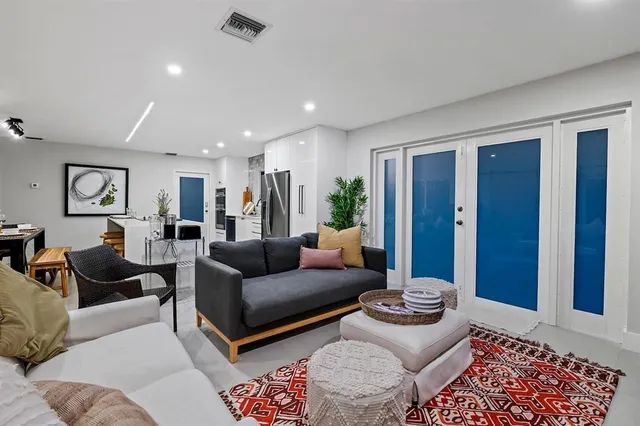 a bedroom with furniture and painting on the wall