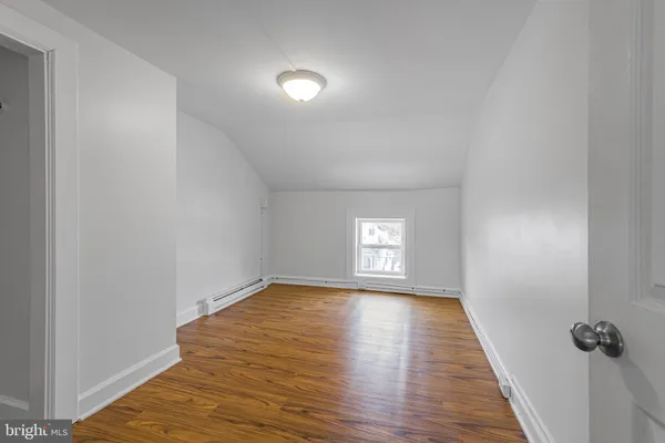 a view of an empty room and a window