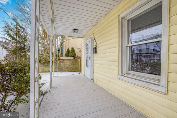 a view of a porch with wooden floor and balcony