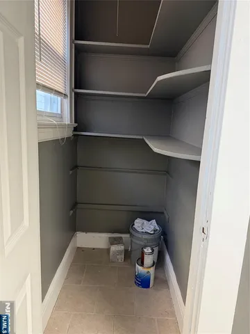 a view of empty room with empty racks