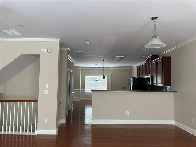 a view of a kitchen with a sink and a window