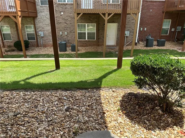 a view of a pathway both side of house