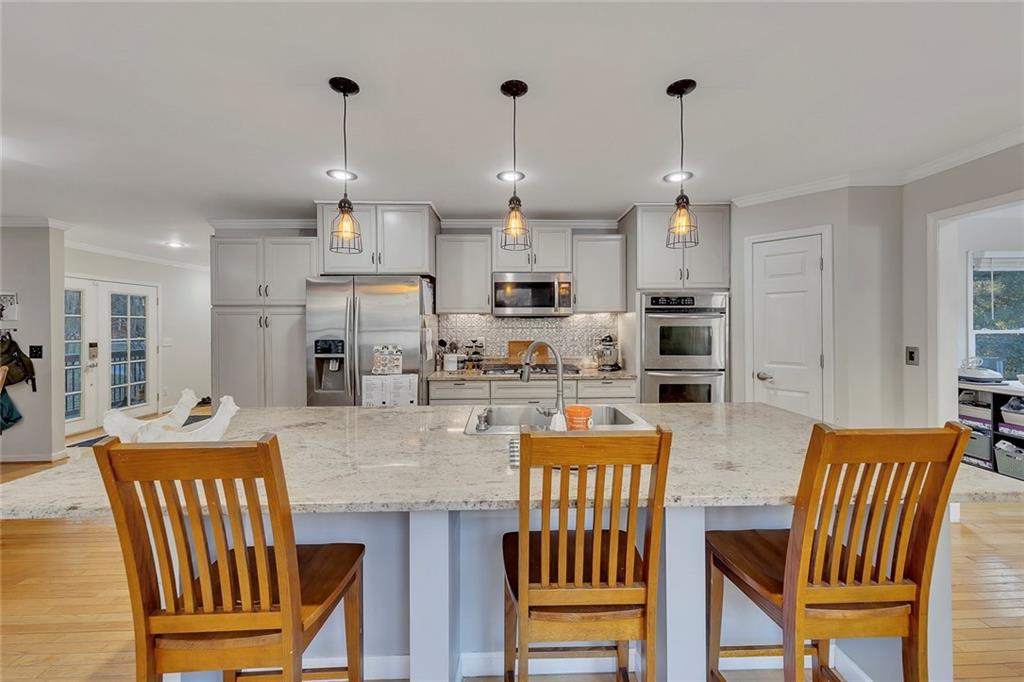 1620 Palm Street Canton, GA 30115 - Photo 14 of 72 a view of kitchen and dining area with furniture