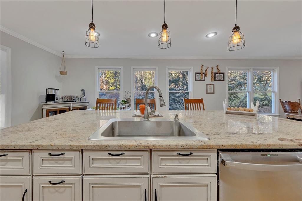 1620 Palm Street Canton, GA 30115 - Photo 17 of 72 a sink with granite countertop white cabinets and a granite counter top