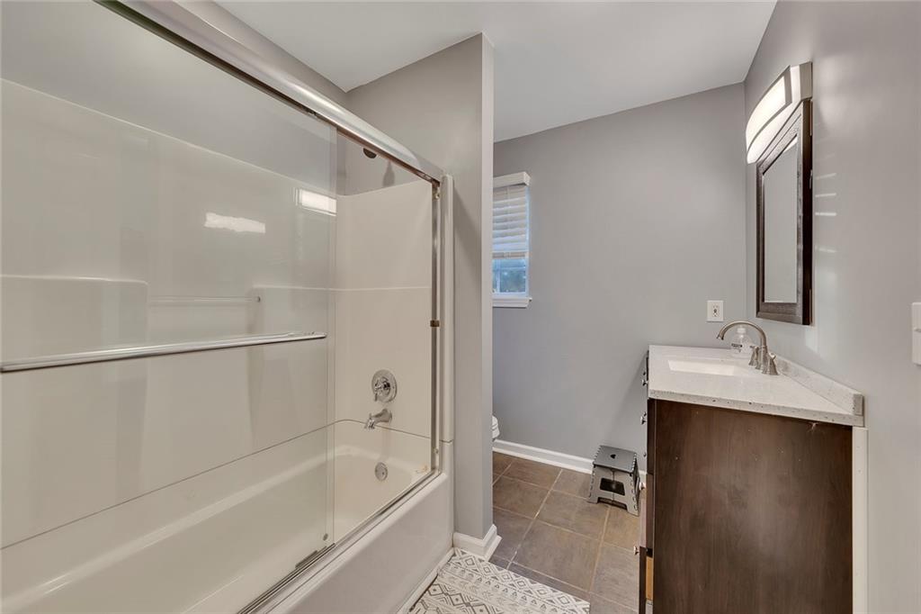 1620 Palm Street Canton, GA 30115 - Photo 36 of 72 a bathroom with a bathtub and a sink