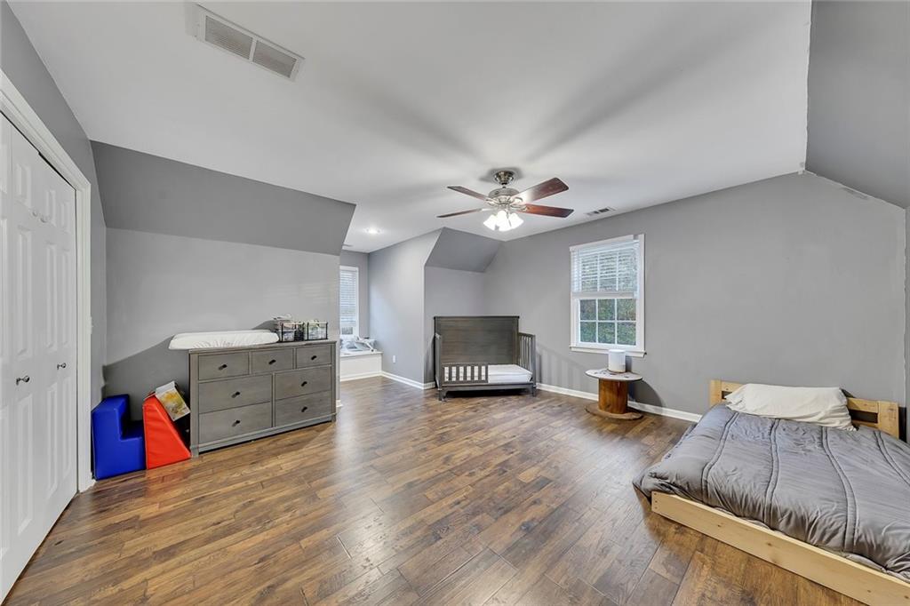 1620 Palm Street Canton, GA 30115 - Photo 43 of 72 a living room with furniture and a flat screen tv