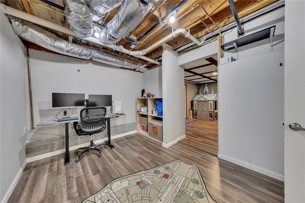 1620 Palm Street Canton, GA 30115 - Photo 46 of 72 a view of a hallway with wooden floor and a workspace