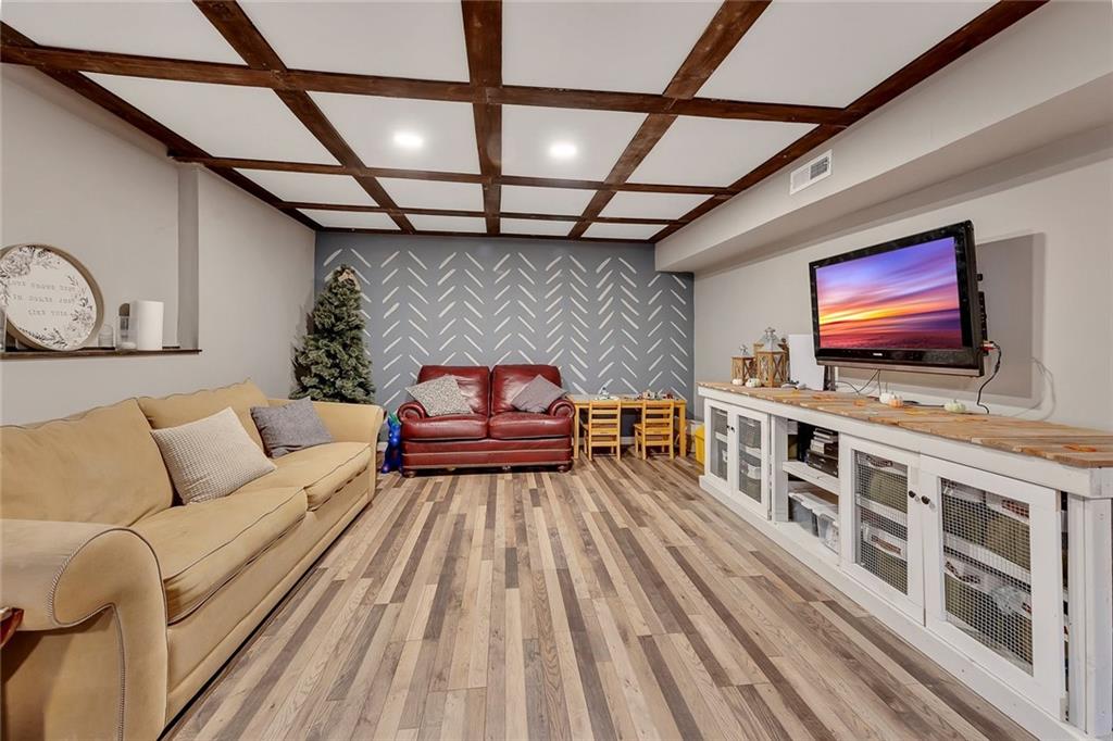 1620 Palm Street Canton, GA 30115 - Photo 49 of 72 a living room with furniture and a flat screen tv