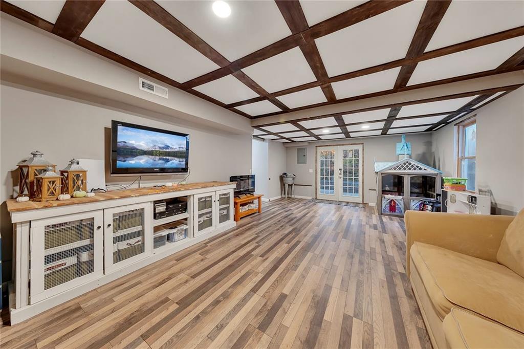 1620 Palm Street Canton, GA 30115 - Photo 50 of 72 a view of a livingroom with furniture a flat screen tv and a dishwasher