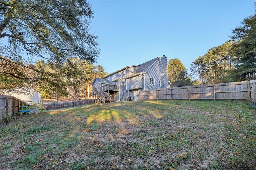 1620 Palm Street Canton, GA 30115 - Photo 56 of 72 a view of a house with a yard