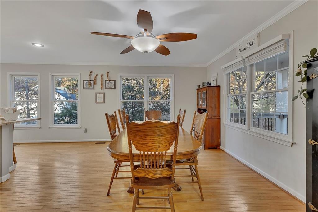 1620 Palm Street Canton, GA 30115 - Photo 10 of 72 a dining room with furniture a window and wooden floor