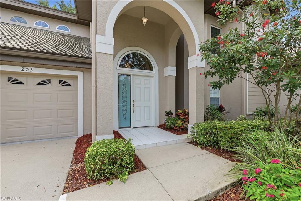 203 Via Perignon, Unit 24 Naples, FL 34119 - Photo 2 of 42 Front of this lovely coach home.