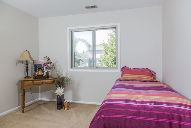 710 Heather Lane Bartlett, IL 60103 - Photo 16 of 26 a bedroom with a bed and a window