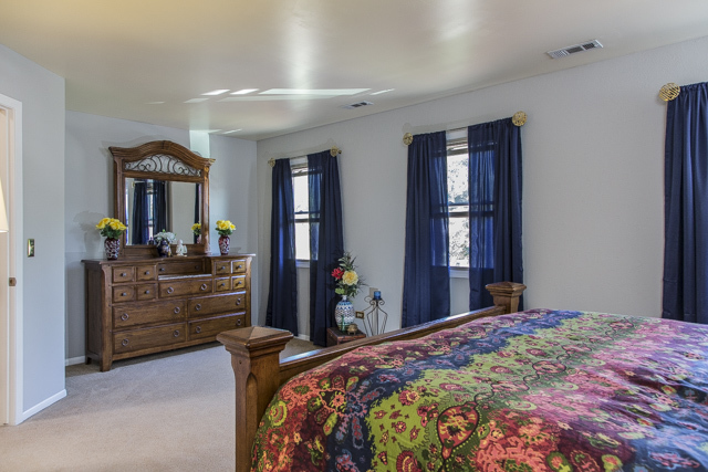 710 Heather Lane Bartlett, IL 60103 - Photo 19 of 26 a bed room with a bed and a dresser
