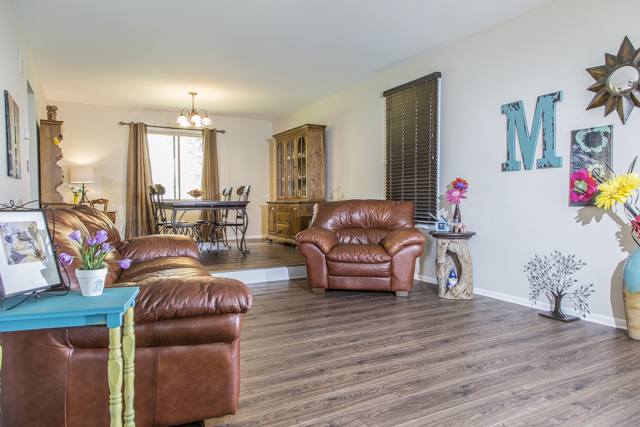 710 Heather Lane Bartlett, IL 60103 - Photo 3 of 26 a living room filled with furniture and a wooden floor