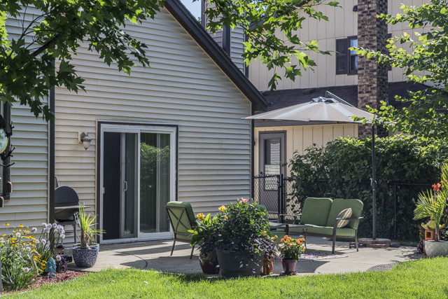 710 Heather Lane Bartlett, IL 60103 - Photo 24 of 26 a view of a chair and table in back yard of the house