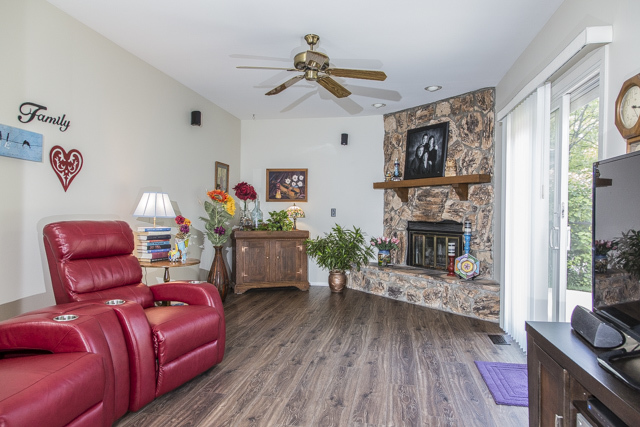 710 Heather Lane Bartlett, IL 60103 - Photo 7 of 26 a living room with furniture and a fireplace