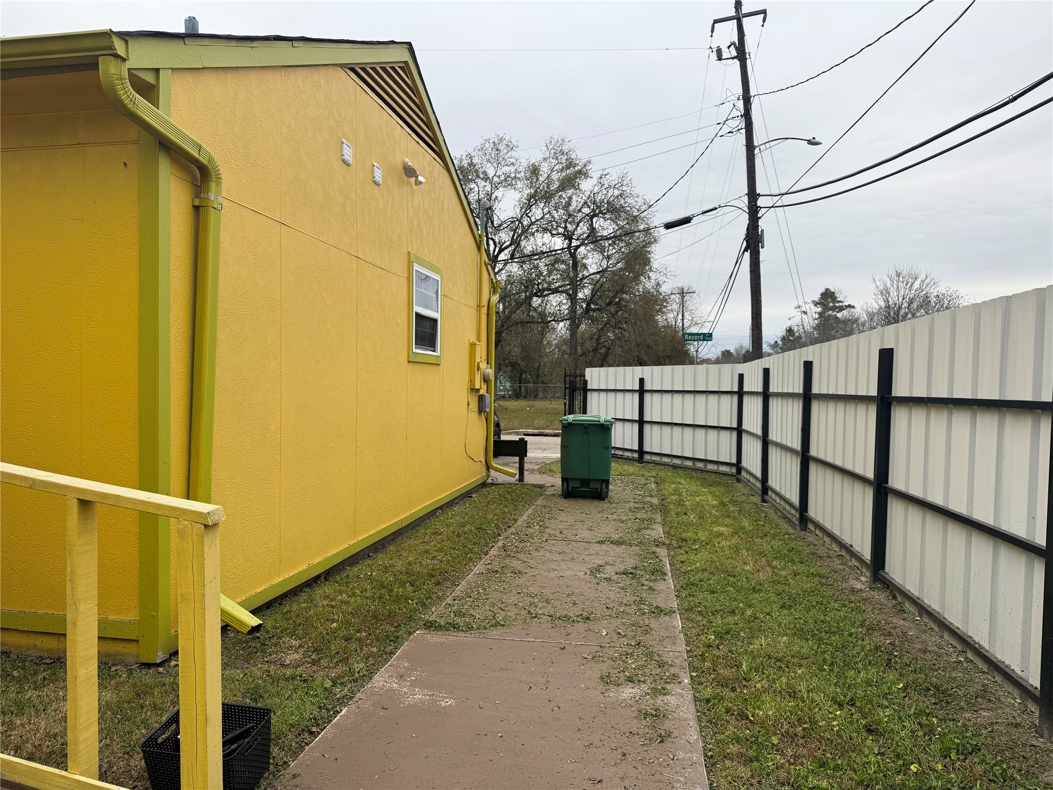 7901 Record Street Houston, TX 77028 - Photo 9 of 17 a view of a back yard with a wooden fence